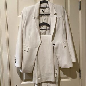 White suit blazer, and boot cut pants